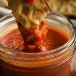pizza waffle being dipped in marinara sauce