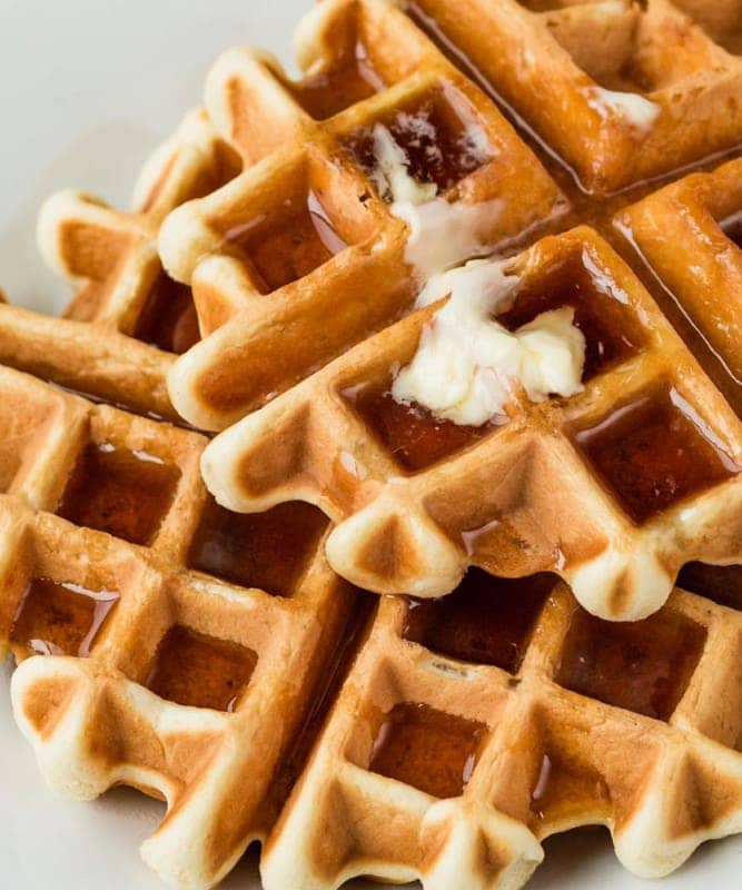 golden Belgian waffles, butter melting golden Belgian waffles with butter melting